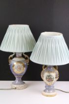 Two early 20th century lustre table lamps of urn form, with gilt details, one being decorated with a