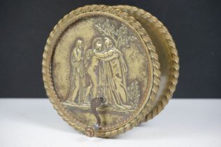 Early 20th Century brass music box of cylindrical shape with moulded neo classical relief scene to