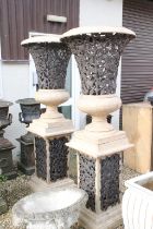 Large pair of plastic garden urns, simulating stone & cast iron, with pierced floral & foliate