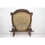 Victorian Firescreen, the frame with foliate carving and the centre with hand painted fabric panel