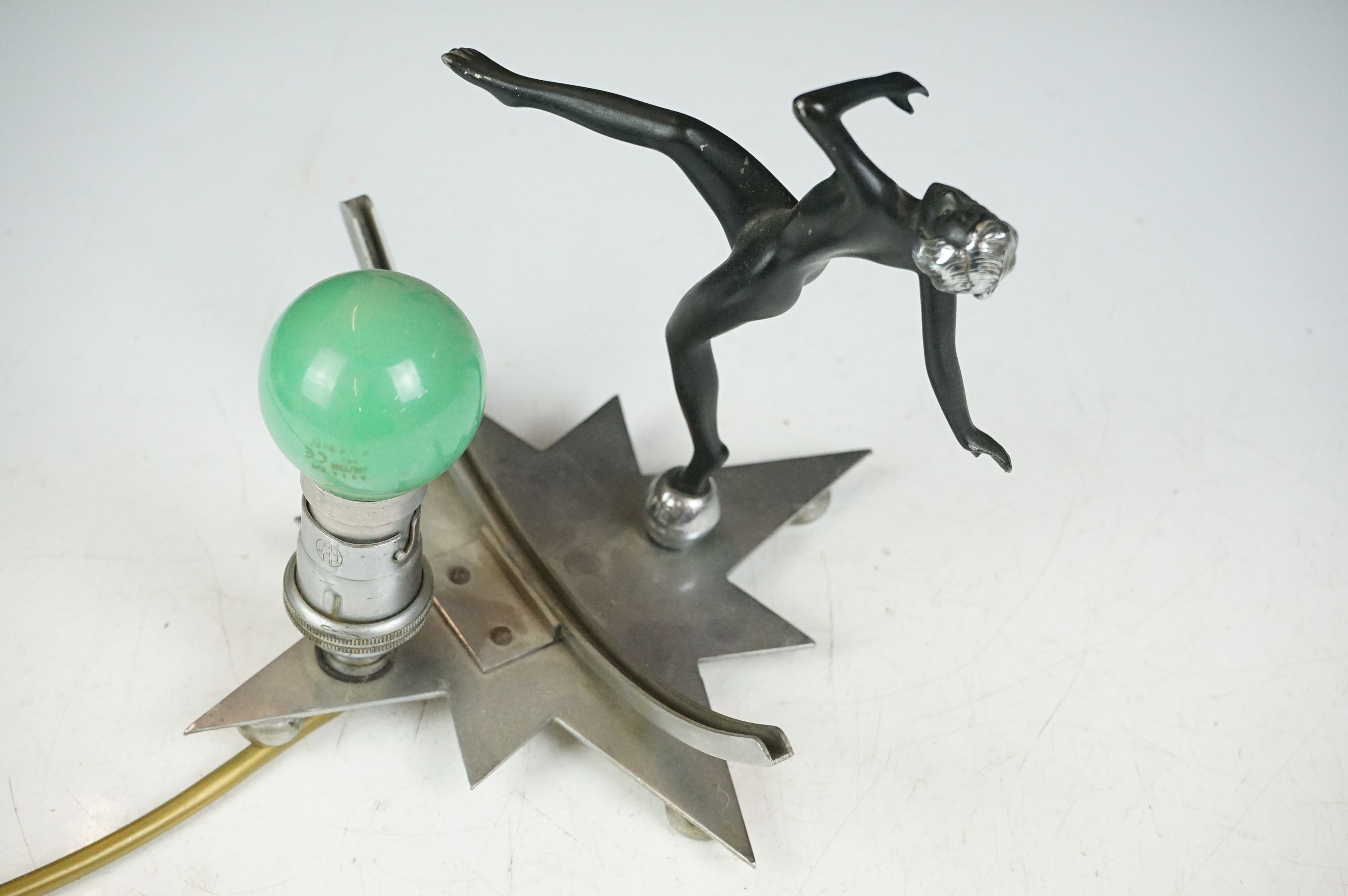 Art Deco wall lamp having a star shaped back plate with a nude female figure and green light bulb. - Image 5 of 9