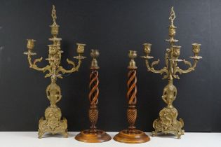 Pair of cast brass five-light candelabra, the branches modelled as Acanthus leaves, each raised on