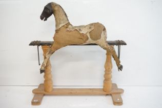 19th century Carved Wooden Rocking Horse in need of restoration, with remnants of the original