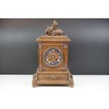 19th Century Victorian carved black forest mantle clock featuring carved rabbits to the top, and