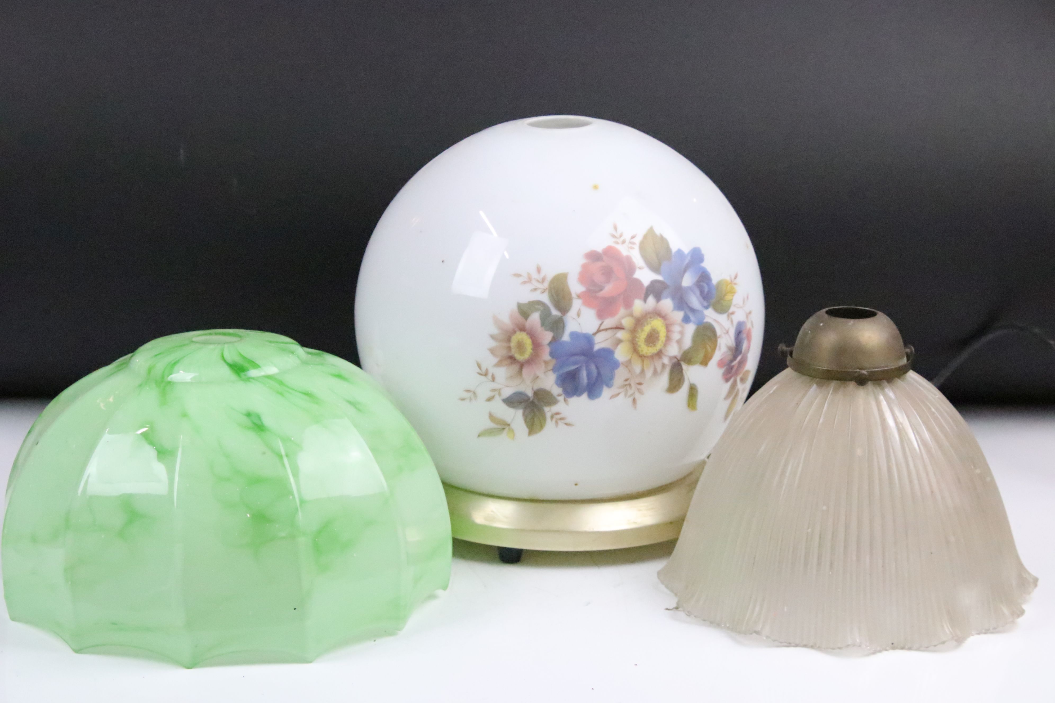 Three glass light shades to include an Art Deco green streaked example (approx 25cm wide), 19th