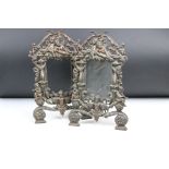 Pair of 19th century cast iron bronze-effect photograph frames, pierced and decorated with putti &