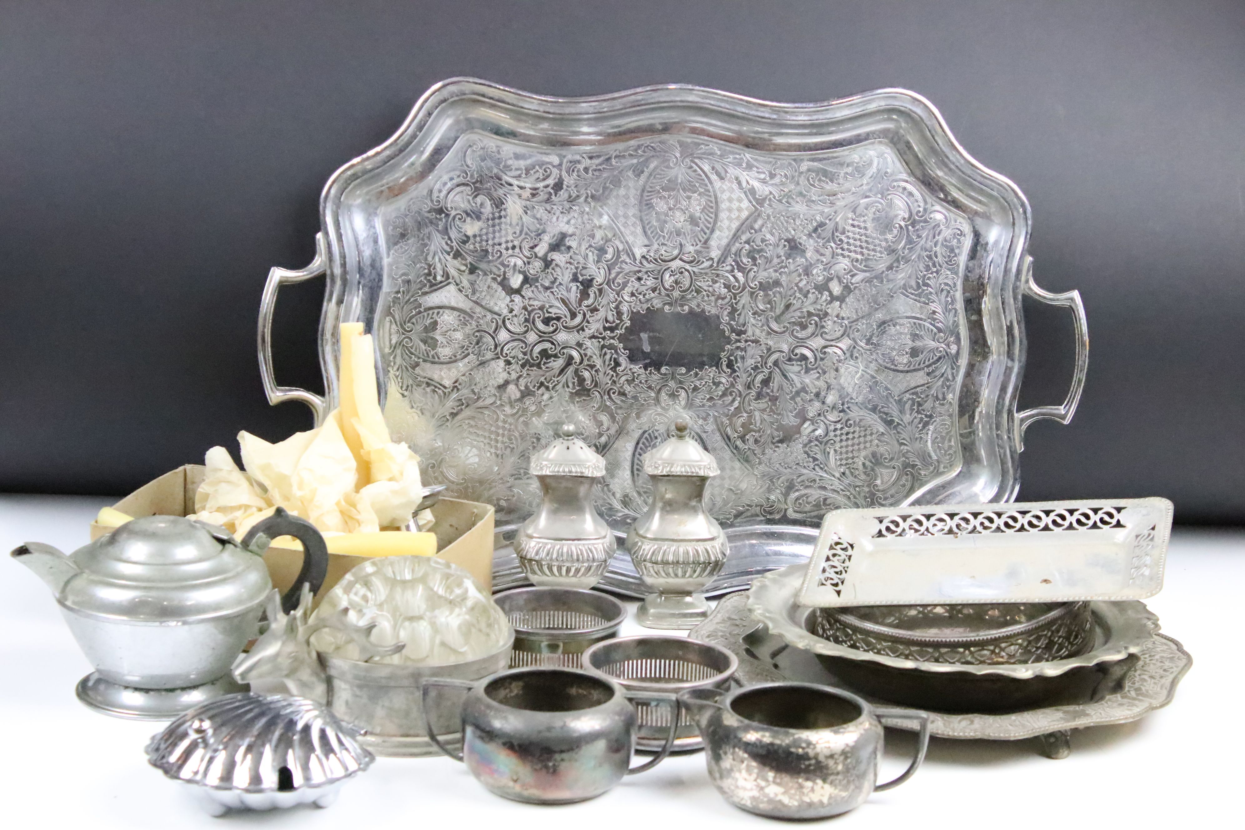 A small collection of mixed silver plate to include trays, teapot, coasters, sugar bowl, cream