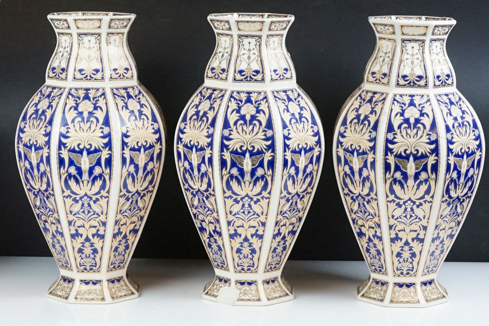 Set of four 20th Century ceramic vases of panelled octagonal design, each each having blue and - Image 2 of 16