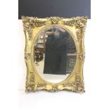 18th century style Gilt Framed Mirror in the Italianate manner with ornate foliate moulding and oval