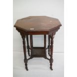 Early 20th century Mahogany Octagonal Occasional Table with central under-shelf, raised on turned