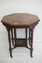 Early 20th century Mahogany Octagonal Occasional Table with central under-shelf, raised on turned