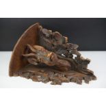 Late 19th Century Victorian carved black forest corner shelf. The shelf having a carved deer bust