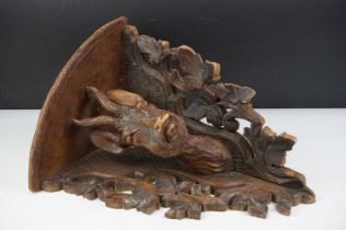 Late 19th Century Victorian carved black forest corner shelf. The shelf having a carved deer bust