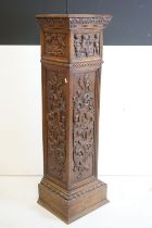 19th century Oak Square Pedestal Stand, carved with panels including cherubs with a goat,