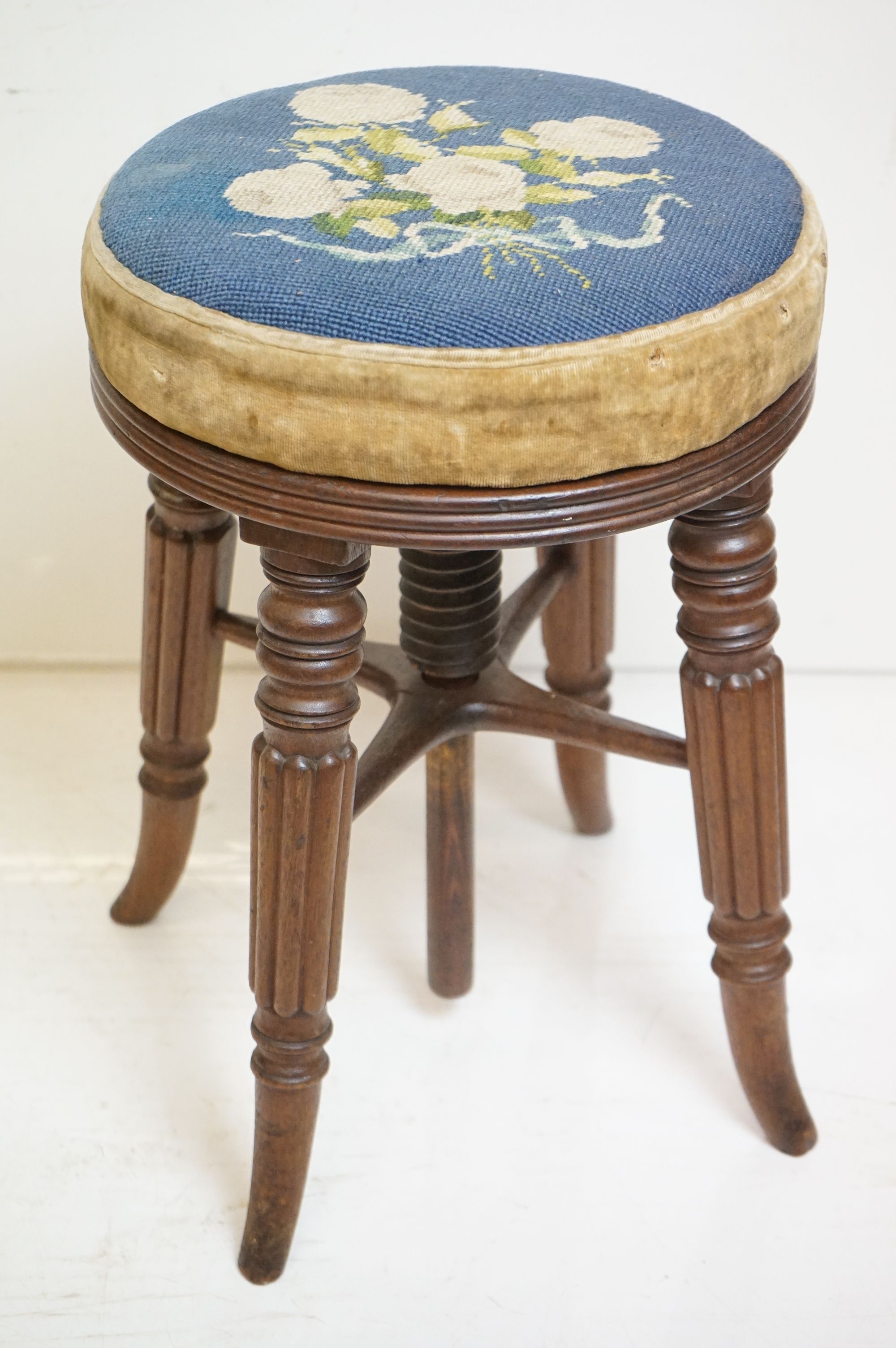 Victorian Mahogany Circular Adjustable Piano Stool with woolwork upholstered seat and raised on
