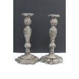 A pair of antique fully hallmarked sterling silver candlesticks, stand approx 24cm in height.