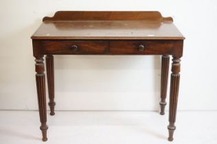 19th century Mahogany Side Table with two drawers raised on turned fluted legs, 97cm long x 51cm