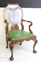 Early 20th century Queen Anne style Walnut Elbow Chair with shaped back, scrolling arms and raised