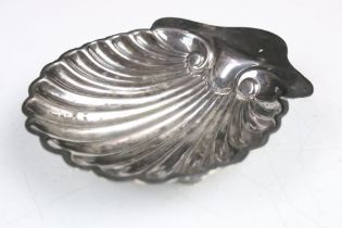 A fully hallmarked sterling silver pin dish in the form of a scallop shell.