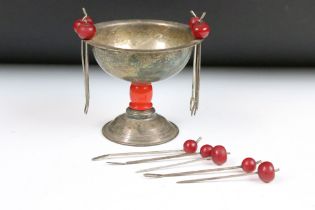 An early 20th century Art Deco cocktail bowl together with cocktail sticks with cherry amber