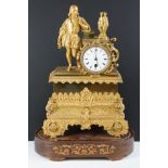 19th Century French gilt mantle clock having a gilt male figure to the top beside a white