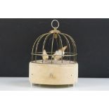 Mid 20th Century automaton musical jewellery box in the form of a bird cage having an upholstered