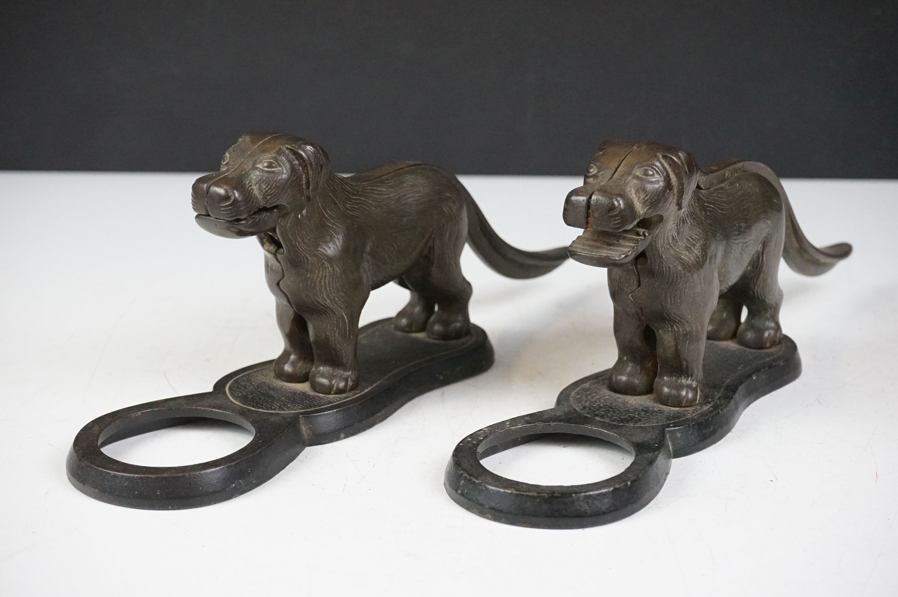 Pair of early 20th Century cast iron nut crackers in the from of dogs with mechanical tails and