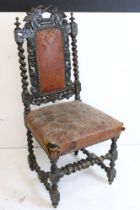 Two Victorian Oak Hall Chairs in the Carolean manner, both with heavy foliate carving and barley-