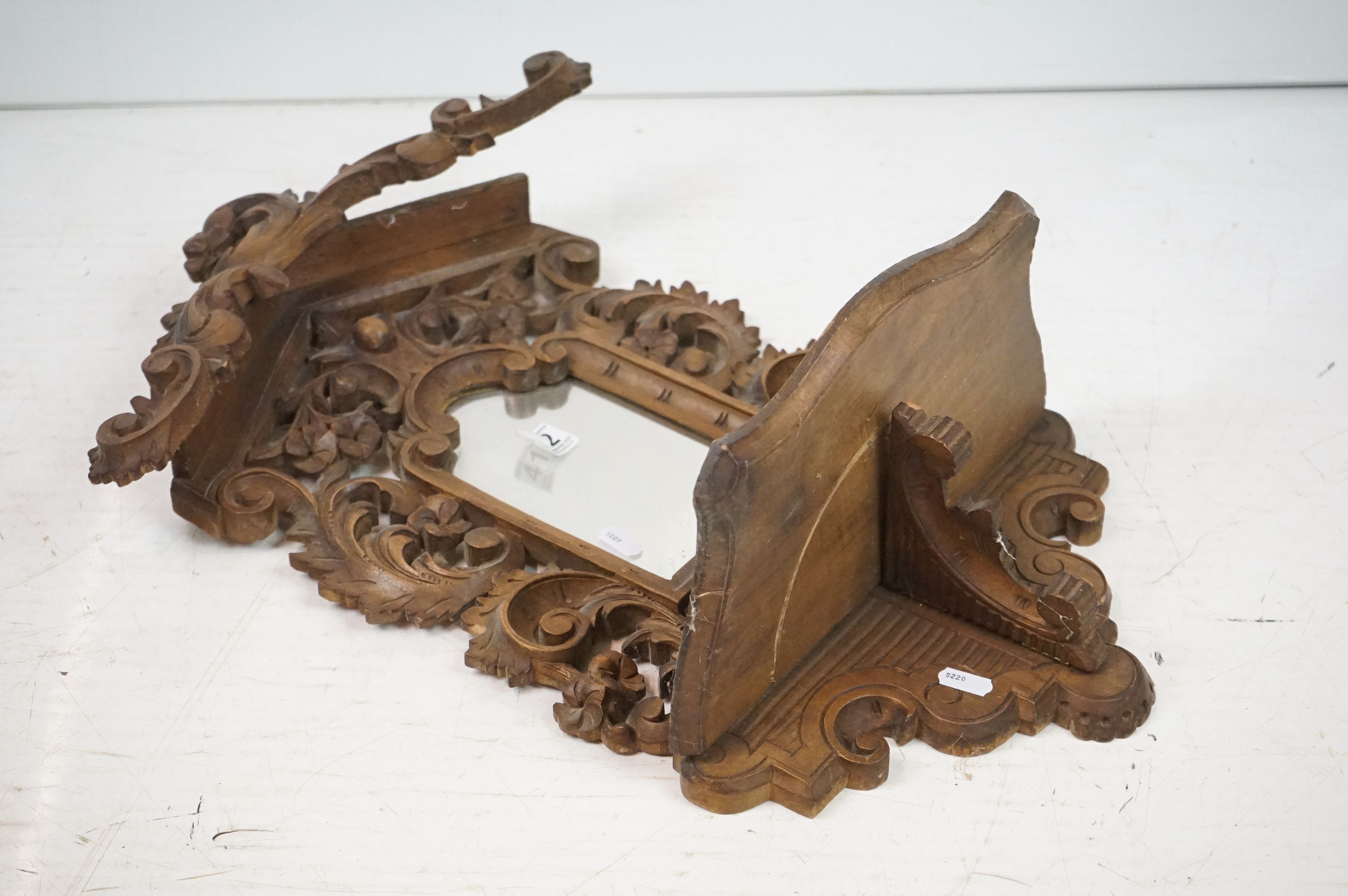Black Forest Walnut Hanging Hall Mirror and folding Shelf, carved with foliate scrolls, 59cm high - Image 5 of 7