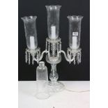 Moulded clear glass three-branch electric candelabrum table lamp, with etched hurricane glass shades