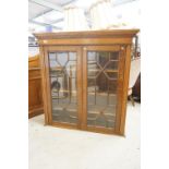 Early 20th century Oak Glazed Cabinet, the two doors opening to three shelves, 117cm wide x 32cm