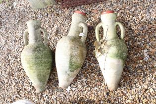 Set of three terracotta twin-handled urns, of typical form (approx 60cm high)