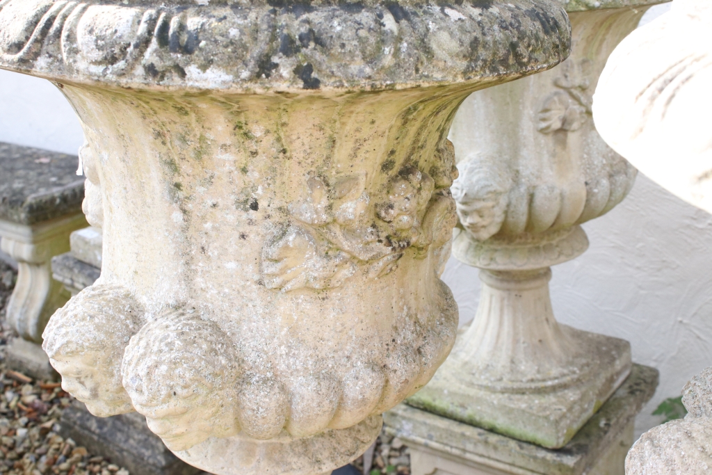 Pair of reconstituted stone garden urns of campana form, with relief facial mask decoration and - Image 5 of 5