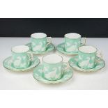 Five Royal Crown Derby Chinese Bird pattern coffee cans and saucers having a green ground with