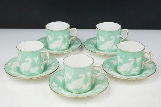 Five Royal Crown Derby Chinese Bird pattern coffee cans and saucers having a green ground with