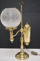 Brass table lamp, the globular shade of etched design, 57.5cm high