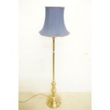 Brass Standard Lamp raised on a circular stepped base, with blue shade, total height 178cm