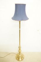 Brass Standard Lamp raised on a circular stepped base, with blue shade, total height 178cm