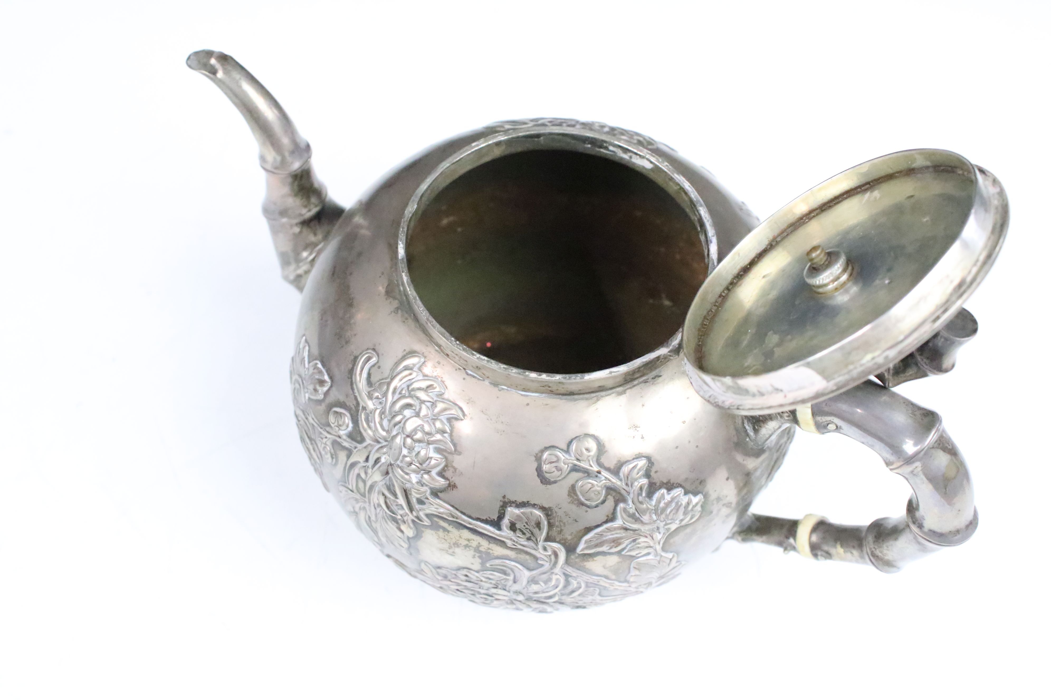 An antique Chinese silver teapot cast with cherry blossom decoration and bamboo style handles and - Image 4 of 8