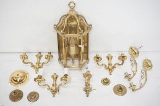 Seven contemporary brass wall lights to include a three-light example (approx 50cm high), a set of