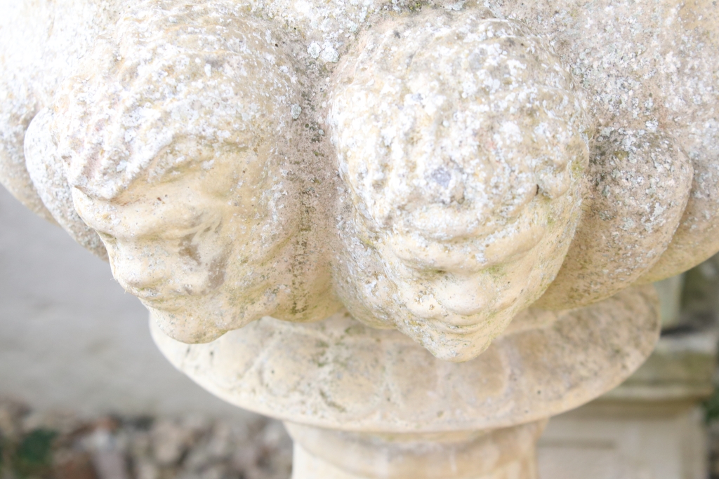 Pair of reconstituted stone garden urns of campana form, with relief facial mask decoration and - Image 4 of 5