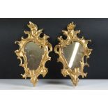 Pair of gilt plaster Girandole wall mirrors with single sconces, of classical scrolling form (approx