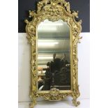 Large Italian style Gilt Framed Mirror in the 18th century manner with ornate shaped and scrolling