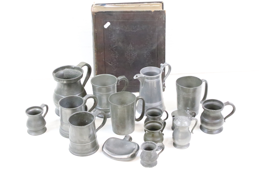 A collection of antique pewter to include tankards, jug, hip flask...etc. together with an antique