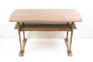 Mid 20th century Teak Rectangular Coffee Table with shelf below raised on shaped supports, 101cm