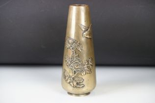 Japanese Polished Bronze Vase with a raised design of a bird flying over flowers, 25cm high