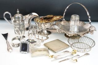 A collection of mixed silver plate to include sugar bowl, cake stand, toast rack, sugar shaker...