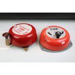 Two wall mounted manual wind fire alarm bells, both being handle operated.