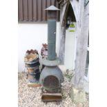 Large Cast Iron Chiminea, 180cm high together with a Small Cast Iron Feed Trough, 42cm long