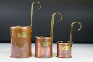 Set of Three Graduating Copper Measures with brass hanging handles, ranging from 2 Pint to 1/2 Pint,